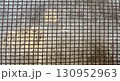 Rustic metal grid texture with square wire mesh pattern 130952963