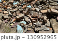 Pile of construction rubble with broken bricks and cement pieces 130952965