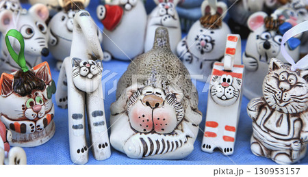 Souvenir figurines of cats and other animals in the gift shop 130953157
