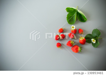 Still life with strawberries, top view on a textured background 130953481