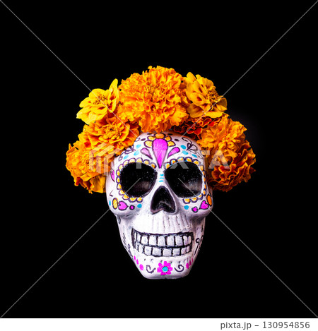 Painted skull with vibrant marigold flowers. Dia De Los Muertos. Painted skull with vibrant marigold flowers. Dia De Los Muertos. 130954856