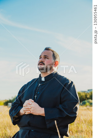 Deacon Praying In The Nature With All His Heart  130955461