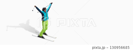 Excited female skier celebrating victory with raised arms isolated on white. Banner Excited female skier celebrating victory with raised arms isolated on white. Banner 130956685