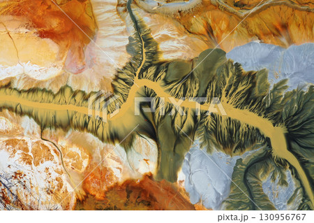 Aerial view of surreal natural patterns of gold cyanide leaching flowing into decanting lake Aerial view of surreal natural patterns of gold cyanide leaching flowing into decanting lake 130956767