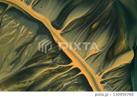 Aerial view of surreal natural patterns of gold cyanide leaching flowing into decanting lake 130956768