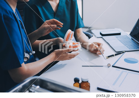 dentist consultation - patient visit at dental clinics office dentist consultation - patient visit at dental clinics office 130958370