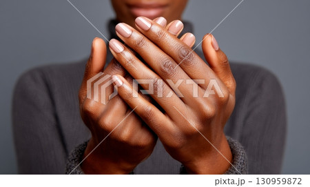 African adult female with elegant manicured hands. 130959872