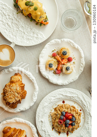 Top view of breakfast table with gourmet dishes Top view of breakfast table with gourmet dishes 130960184
