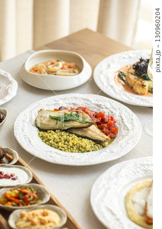 Assorted gourmet dishes with vegetables seafood 130960204