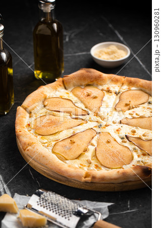 Gourmet pear and cheese pizza with crispy crust 130960281