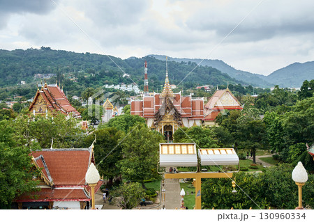 Aerial view of wat chalong temple complex in phuket surrounded by lush greenery 130960334