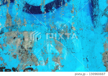 Aged Textured Blue Wall with Peeling Paint for Urban Retro 90s Aesthetic 130960887