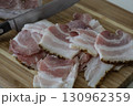 Ukrainian traditional cuisine. Very tasty pieces of salo. Raw ukrainian bacon or salo on wooden board. Sliced salted pork lard (salo). Food concept. 130962359