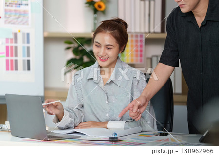 Interior Design Consultation. Professionals discussing color palettes and home aesthetics. Interior Design Consultation. Professionals discussing color palettes and home aesthetics. 130962966