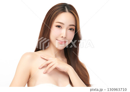 A beautiful young Asian woman with clean, fresh skin against a white background. Skincare, facial treatment, cosmetology, beauty, and spa. An elegant portrait of an Asian woman. A beautiful young Asian woman with clean, fresh skin against a white background. Skincare, facial treatment, cosmetology, beauty, and spa. An elegant portrait of an Asian woman. 130963710