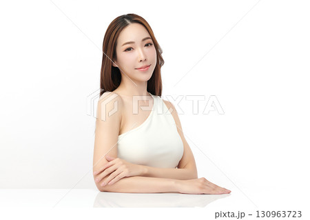 A beautiful young Asian woman with clean, fresh skin against a white background. Skincare, facial treatment, cosmetology, beauty, and spa. An elegant portrait of an Asian woman. A beautiful young Asian woman with clean, fresh skin against a white background. Skincare, facial treatment, cosmetology, beauty, and spa. An elegant portrait of an Asian woman. 130963723
