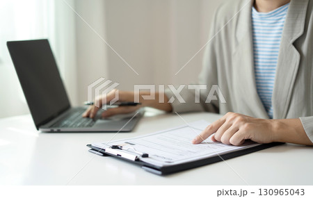 Business woman employer holding resume hiring recruit looking cv resume to hire candidates, analyzing information before job interview. Recruitment concepts 130965043