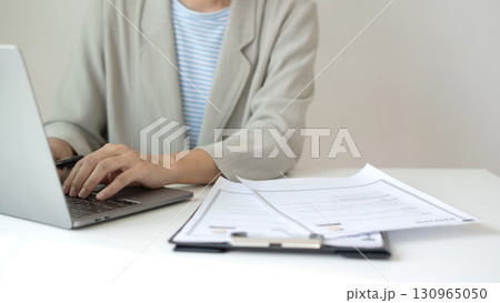 Business woman employer holding resume hiring recruit looking cv resume to hire candidates, analyzing information before job interview. Recruitment concepts 130965050