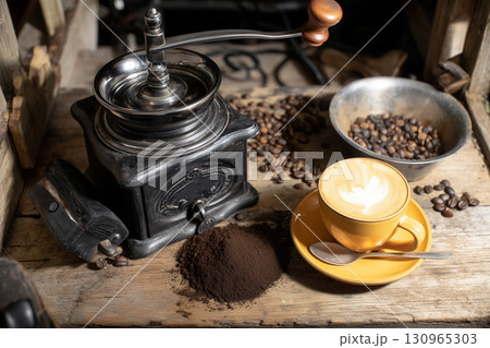 Rustic Coffee Grinder with a Freshly Brewed Latte Rustic Coffee Grinder with a Freshly Brewed Latte 130965303