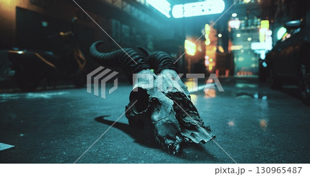 A ram skull lies in the middle of a wet urban street. Neon signs illuminate the surroundings, creating an eerie nighttime atmosphere filled with a sense of mystery and intrigue. 130965487