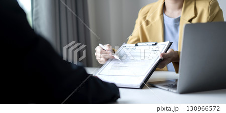 Business people hold a resume and talk to job applicants for job interviews about careers and Their personal history in the company. Recruitment concepts 130966572