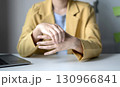 Woman hand with wrist pain numbness and pain in the palm of the hand has pain and tingling in the nerve endings This is a side effect of sitting and working for a long time on a laptop at the office 130966841