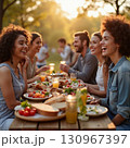 Friends enjoy a joyful meal outdoors at sunset gathering Generative AI 130967397