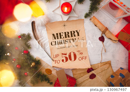 Seasonal sale announcement with festive decorations and promotional offer on Christmas gifts 130967497