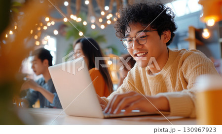 Young South Asian man analyzing survey data on laptop in professional workshop setting. Survey research answer checklist 130967923