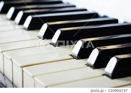 Close up photo of keyboard of an old piano Close up photo of keyboard of an old piano 130968297