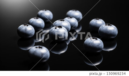 Blueberries on Reflective Black Surface with Soft Light 130969234