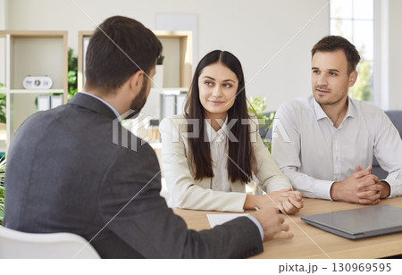Lawyer paper office agreement consultation, business ownership documents for young couple Lawyer paper office agreement consultation, business ownership documents for young couple 130969595
