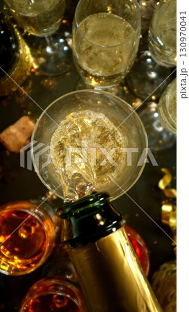 Freeze motion of pouring champagne into flute. Concept of celebration and success. 130970041