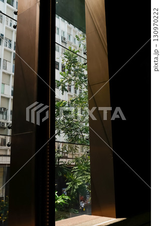Looking from window with beautiful scene, city scene. Building structure.  130970222