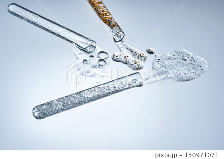 Three test tubes with spilled serums. Demonstration of textures. 130971071