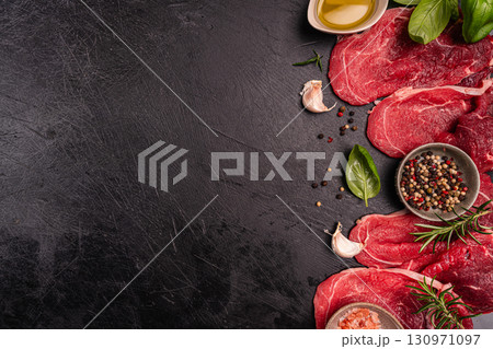 Raw organic steak with ingredients for cooking 130971097