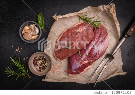Preparation for cooking raw duck breast Preparation for cooking raw duck breast 130971102