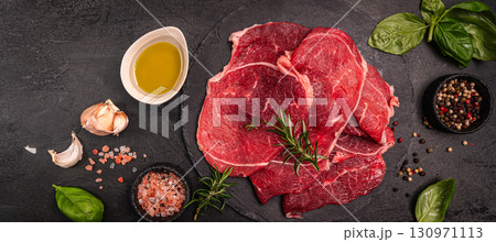 Raw organic steak with ingredients for cooking 130971113
