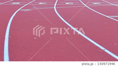 Athletics track at the stadium. Tartan track and running track. The concept of running as a journey through life. Athletics track at the stadium. Tartan track and running track. The concept of running as a journey through life. 130971946