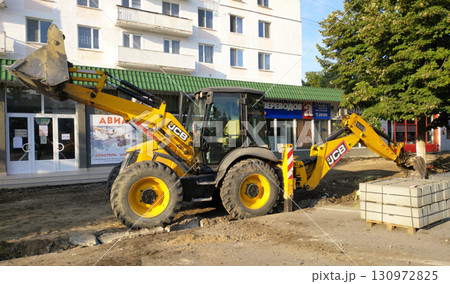 Construction equipment on a city street 130972825