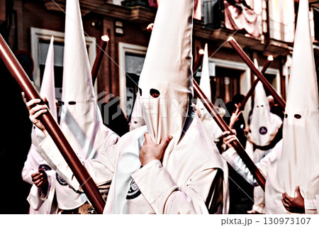 Nazarene-penitent, during the Holy Week procession in Alcala de Guadaira, Andalusia, Seville.	 130973107