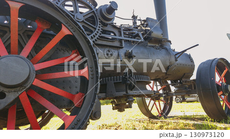 Nitra, Slovakia - September 4, 2025: A vintage traction engine on display at the Nitra Agricultural University. Close-up. Wheels. 130973120