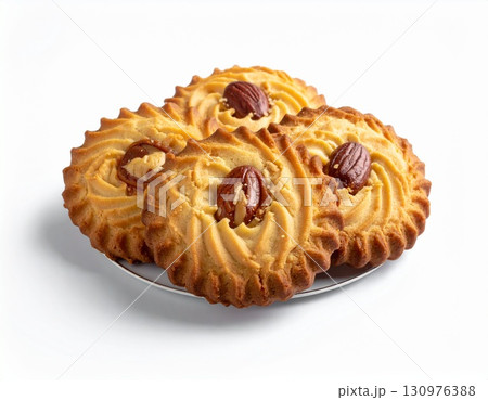 Butter Cookies with Pecans on White Plate Butter Cookies with Pecans on White Plate 130976388