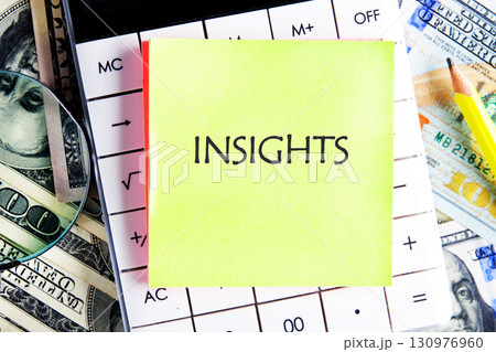 INSIGHTS word written on the sticker on the calculator on the background of banknotes. Business and Analytics concept INSIGHTS word written on the sticker on the calculator on the background of banknotes. Business and Analytics concept 130976960
