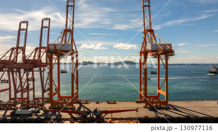 Aerial view container cargo ship international port terminal with gantry crane, Global business import export logistic maritime transport by container cargo ship vessel, Container ship cargo freight. 130977116