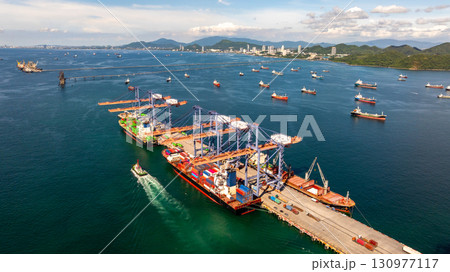 Aerial view container cargo ship international port terminal with gantry crane, Global business import export logistic maritime transport by container cargo ship vessel, Container ship cargo freight. 130977117
