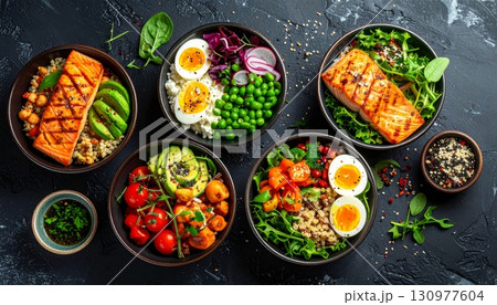 A colorful, healthy vegetarian dish of fresh vegetables on a wooden plate A colorful, healthy vegetarian dish of fresh vegetables on a wooden plate 130977604