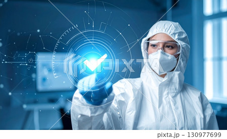 A caring female medical doctor wearing a mask and holding a syringe symbolizes the front lines of modern healthcare and medical research 130977699