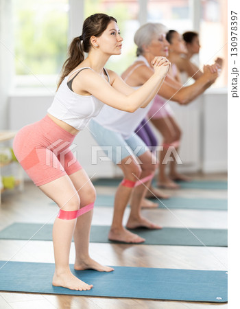 Young woman exercising with pilates band 130978397