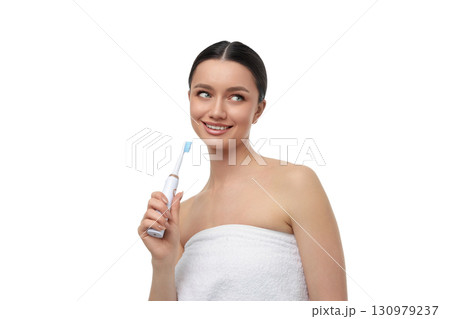 Young woman loves using her electric toothbrush, isolated, PNG Young woman loves using her electric toothbrush, isolated, PNG 130979237